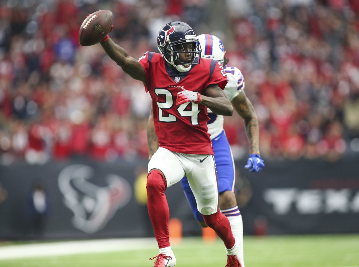 Texans cornerback Johnathan Joseph (24) races toward the end zone after intercepting a pass against the Bills in 2018.